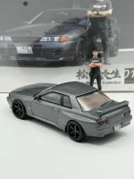 Mini GT 1:64 Nissan Skyline GT-R (R32) Nismo Gunmetal w/ Matsuda Figure