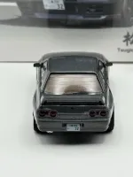 Mini GT 1:64 Nissan Skyline GT-R (R32) Nismo Gunmetal w/ Matsuda Figure