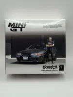 Mini GT 1:64 Nissan Skyline GT-R (R32) Nismo Gunmetal w/ Matsuda Figure