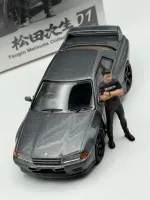 Mini GT 1:64 Nissan Skyline GT-R (R32) Nismo Gunmetal w/ Matsuda Figure