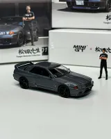 Mini GT 1:64 Nissan Skyline GT-R (R32) Nismo Gunmetal w/ Matsuda Figure