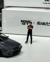 Mini GT 1:64 Nissan Skyline GT-R (R32) Nismo Gunmetal w/ Matsuda Figure